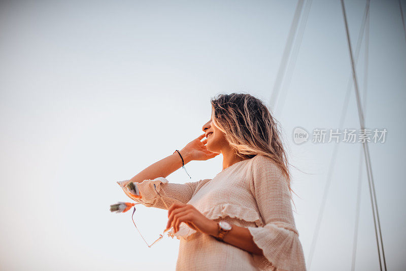 Woman enjoying the moment at the harbor